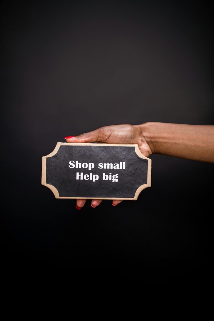 Sign that says shop small help big